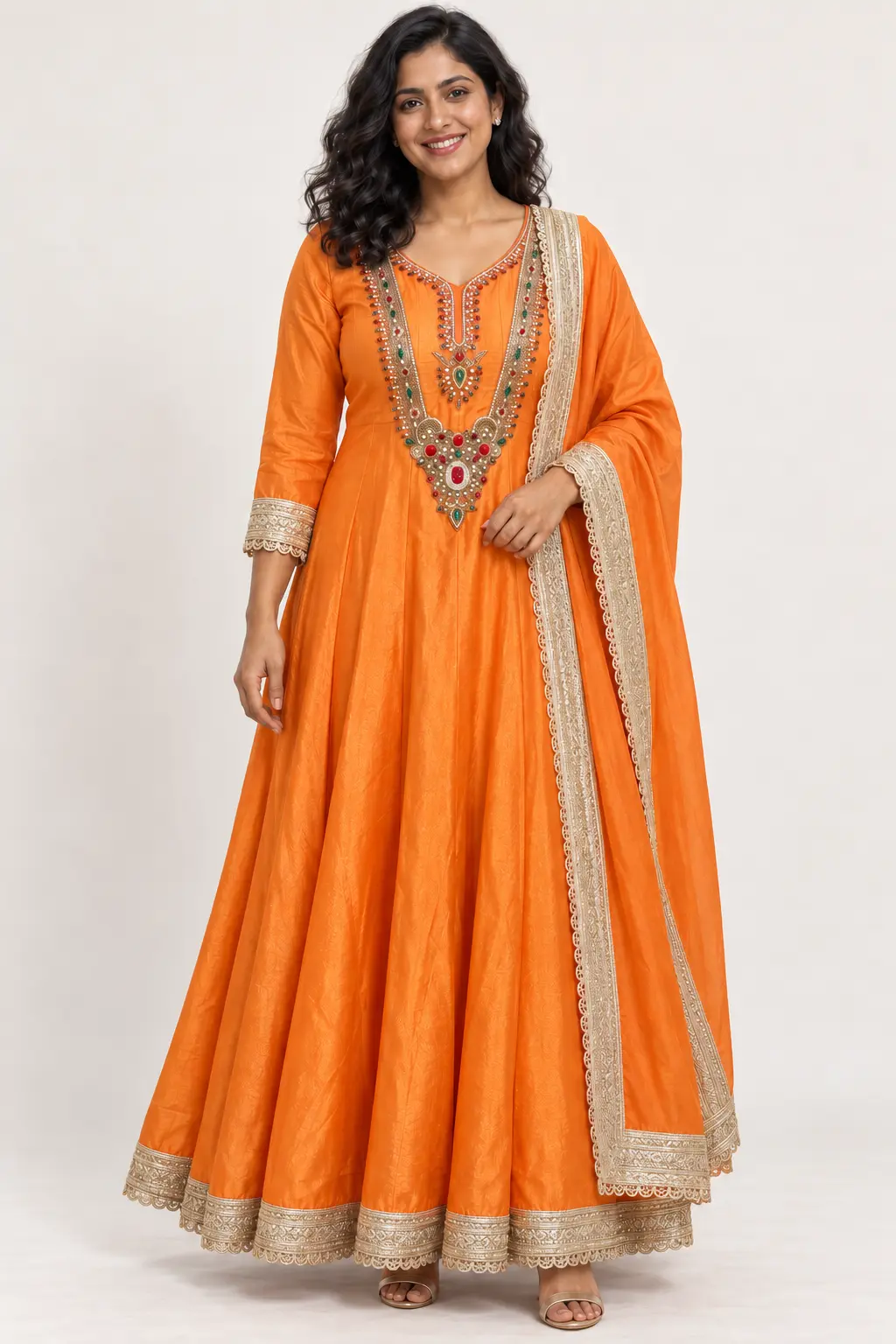 Model styling and design details for Orange Anarkali
